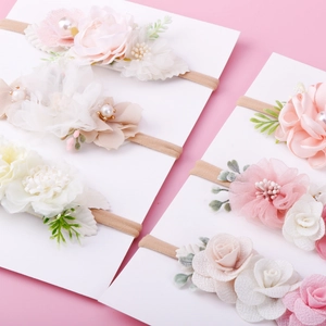 Set of three floral baby headbands with soft fabric flowers and elastic nylon bands