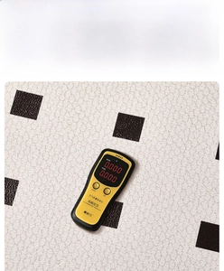 Macro view of French style black and white checkered PVC mat with leather texture surface
