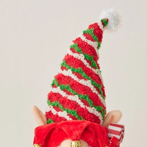 Christmas gnome decoration with red, green and white striped knitted hat and plush pompom