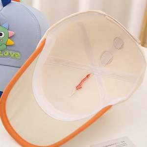 Detail shot of the inner construction and stitching of the kids dinosaur baseball cap