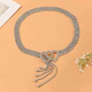 Elegant silver rhinestone belly chain with dual heart design and crystal tassels