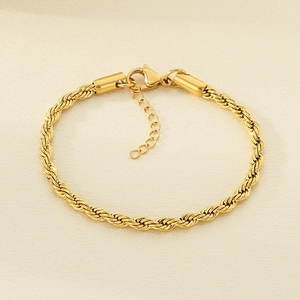 Detailed macro view of 18k gold plated twist rope chain bracelet with adjustable lobster clasp