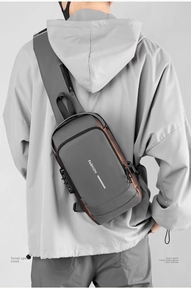 Detail of grey anti-theft chest bag with metal combination lock and durable fabric