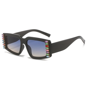 Fashion square sunglasses with black frame blue gradient lenses and side rhinestones