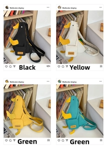 Detailed display of cute duck-shaped canvas crossbody bags in black, white, yellow, and green