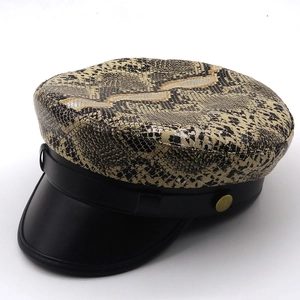 Leopard print newsboy cap with black faux leather brim and vintage gold button