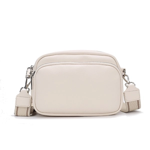 Cream white crossbody bag with wide strap and lychee grain texture on white background