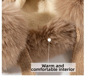 Close-up of thick faux fur lining and beige knit fabric on a thermal winter hat