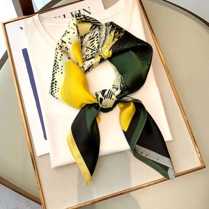 Elegant silk scarf with leopard print and abstract color blocks on white tee shirt