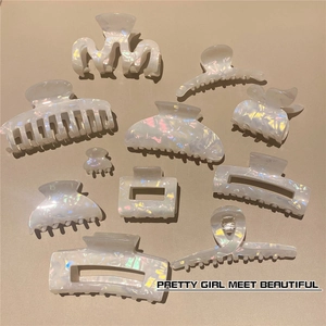 Detailed view of elegant mermaid-colored acetate hair claw clip with pearlescent finish