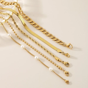 Detailed set of five gold-toned chains featuring snake, twist, bead, and pearl textures