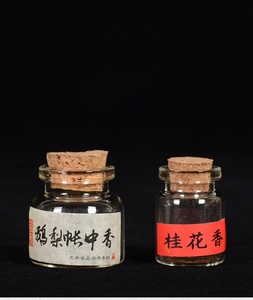 Detailed close-up of handmade incense powder in glass bottles with cork stoppers