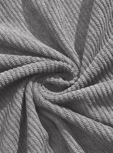 Macro shot of gray corduroy fabric texture showing soft vertical ridges and knit details