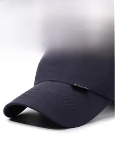 Close-up of navy sun hat showing the structured brim and reinforced parallel stitching