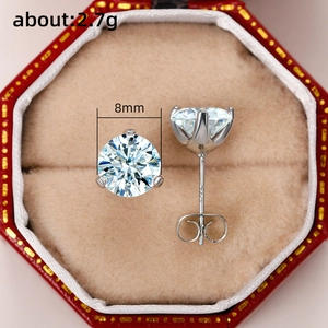 Detailed view of 8mm classic six-prong zircon stud earrings in a red jewelry box