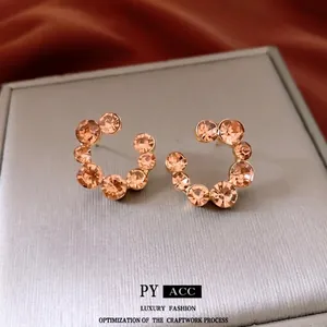 Boucles d'oreilles en C avec cristaux de champagne et finition dorée pour femme