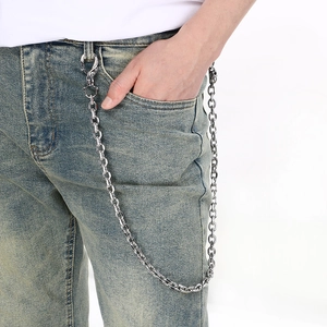 Heavy metal skull buckle wallet chain in silver stainless steel worn on denim jeans