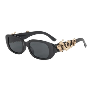 Fashionable small oval sunglasses with golden dragon décor on thick black frames