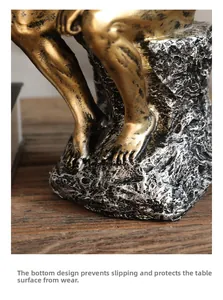 Detail view of the bronze thinker statue's non-slip bottom for desktop protection