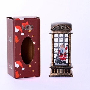 Detailed view of LED Christmas lantern with Santa scene and festive gift packaging box