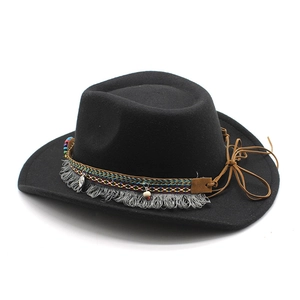 Detail of black felt hat with colorful ethnic woven band, tassels and beaded accents