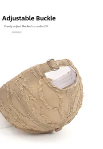 Detail of adjustable metal buckle on khaki seersucker baseball cap with wavy texture