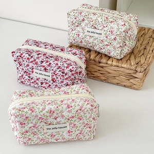 Quilted floral cosmetic bags in three vintage patterns with secure zip closure