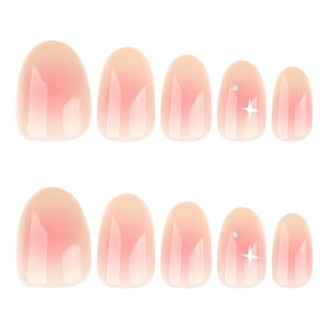Short round blush gradient press-on nails with shiny white star and silver dot accents
