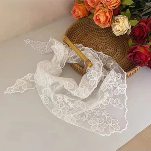 Detailed view of white floral lace triangle scarf showing 80x35cm size and fine embroidery
