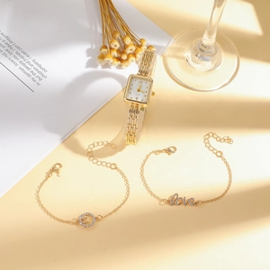 Elegant gold square quartz watch and love bracelet jewelry set on minimalist background