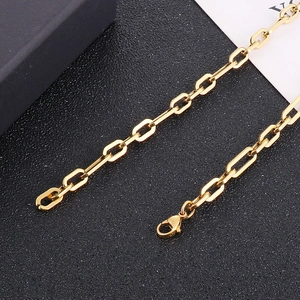 Detailed close-up of a golden titanium steel chain with a secure lobster clasp