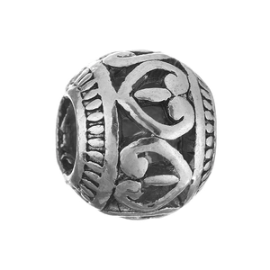 Detailed macro view of vintage hollow silver alloy bead with intricate leaf pattern engravings