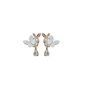 Butterfly pearl earrings with water drop zircon and golden finish on white background
