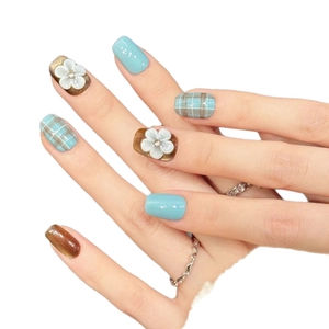 Handmade press-on nails with blue brown plaid patterns and 3D white flower charms
