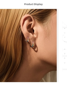 Detail of S925 sterling silver hoop earrings with vibrant rainbow gemstones on a model