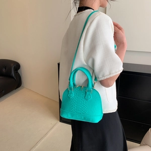 Green snakeskin textured shell bag for women, crossbody style with golden zipper detail