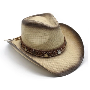 Detail of a straw cowboy hat with ethnic braided band and vintage metal coin charms