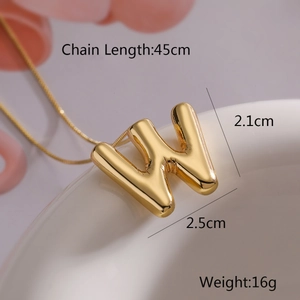 Macro shot of gold letter W balloon pendant necklace with 45cm chain and dimensions