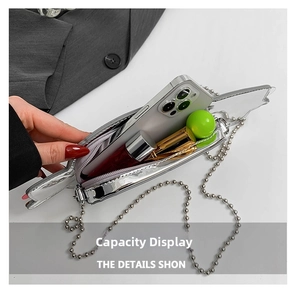Interior view showing the silver car-shaped crossbody bag capacity for phone and lipstick