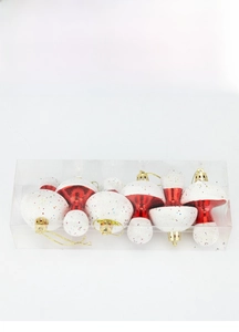 Detailed view of red and white glitter mushroom Christmas tree ornaments in clear box