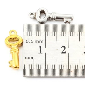 Golden and silver stainless steel key pendants with ruler showing 16mm product size