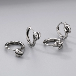 Detail shot of gothic snake and skull hoop earrings in vintage silver stainless steel