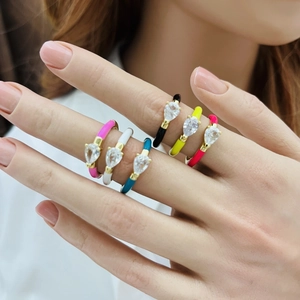Stack of colorful enamel water drop rings with teardrop cubic zirconia in gold plating