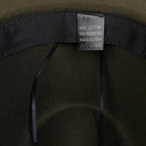 Detail view of the interior sweatband and material label showing 65% cotton blend