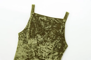 Detailed view of olive green velvet top featuring a vintage square neckline and slim straps