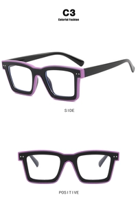 Detail of square TR90 eyeglass frame in black and purple with silver metal dot accents
