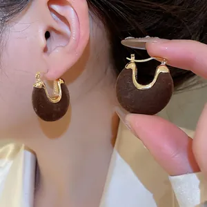 U-shaped gold metal earrings with dark brown flocking texture for autumn winter