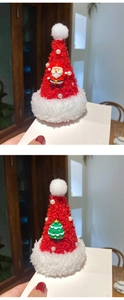 Detail of Christmas hair clips featuring mini Santa and tree dolls with pearls