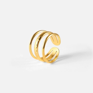 Macro shot of 18k gold plated stainless steel triple layered adjustable ring for women