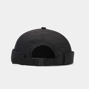 Close-up of a black waterproof miki hat with adjustable nylon strap and plastic buckle